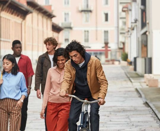 a group of young adults exploring a city