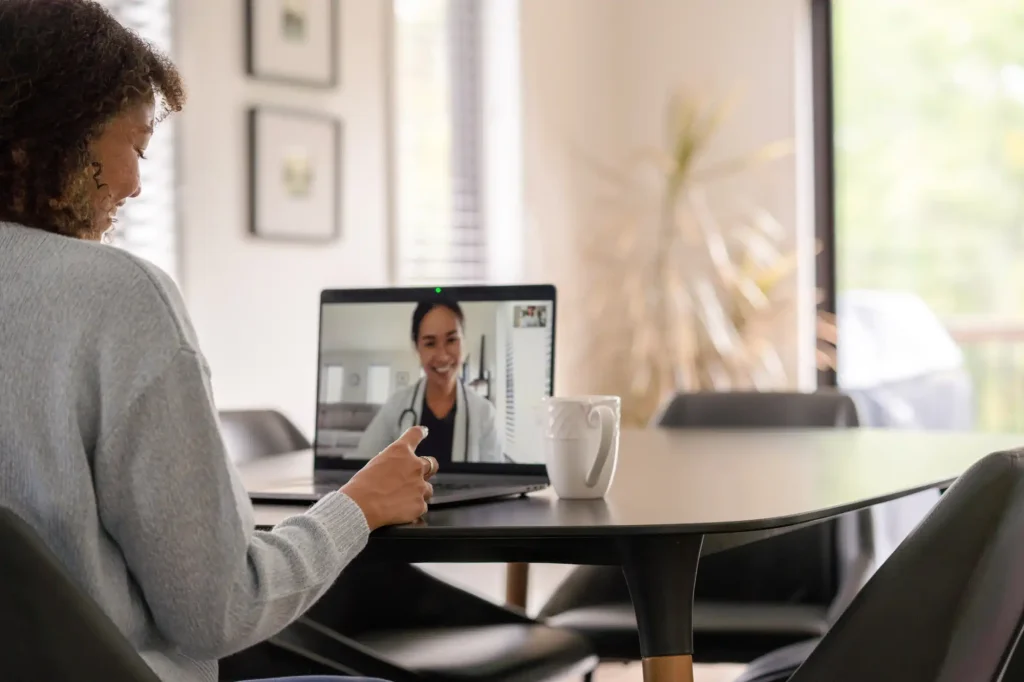 patient and caregiver in a telehealth session