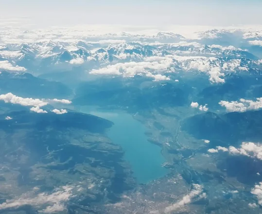 a view from the sky over a mountain lake