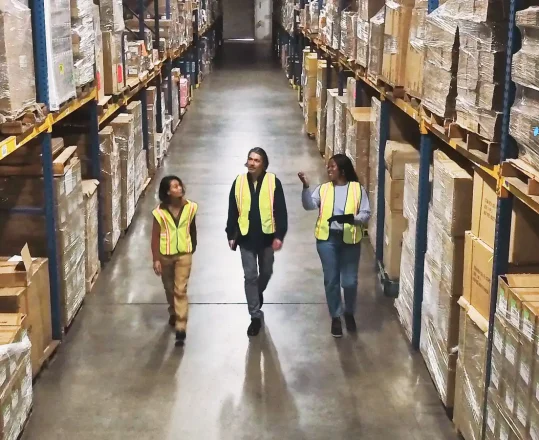 workers in a warehouse tracking item location