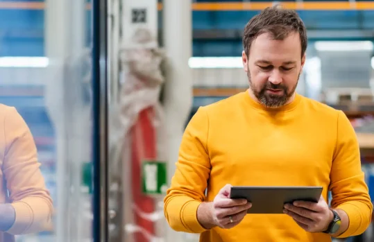 warehouse manager using a tablet