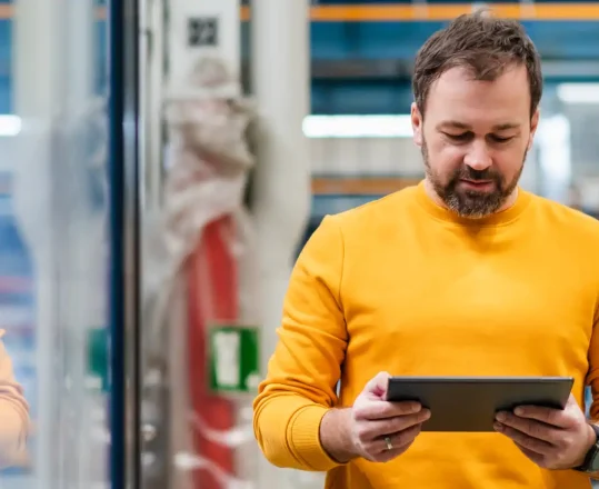 warehouse manager using a tablet