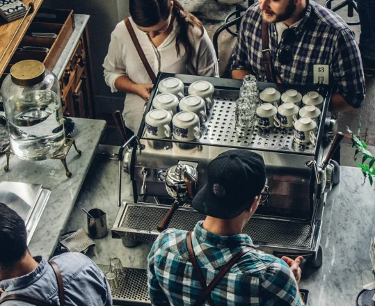 a view of a barista making coffee from above